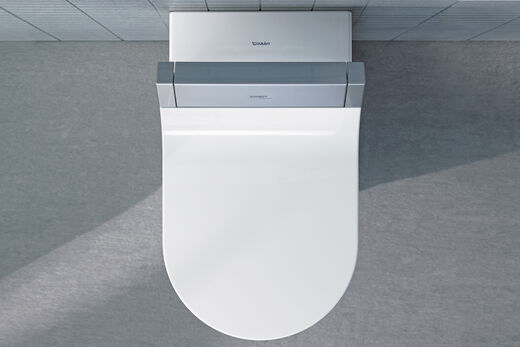 Moderne Dusch-WC-Aufsatz von Duravit. SensoWash e ist eigensicher gegen Rückfließen und hält so die Hauswasserinstallation hygienisch. Draufsicht von oben.