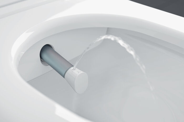 Darstellung des Duschstrahls in einem ViClean-I 100 Dusch-WC von Villeroy & Boch. Die Düse ist flexibel und reinigt sich nach jeder Nutzung von selbst.
