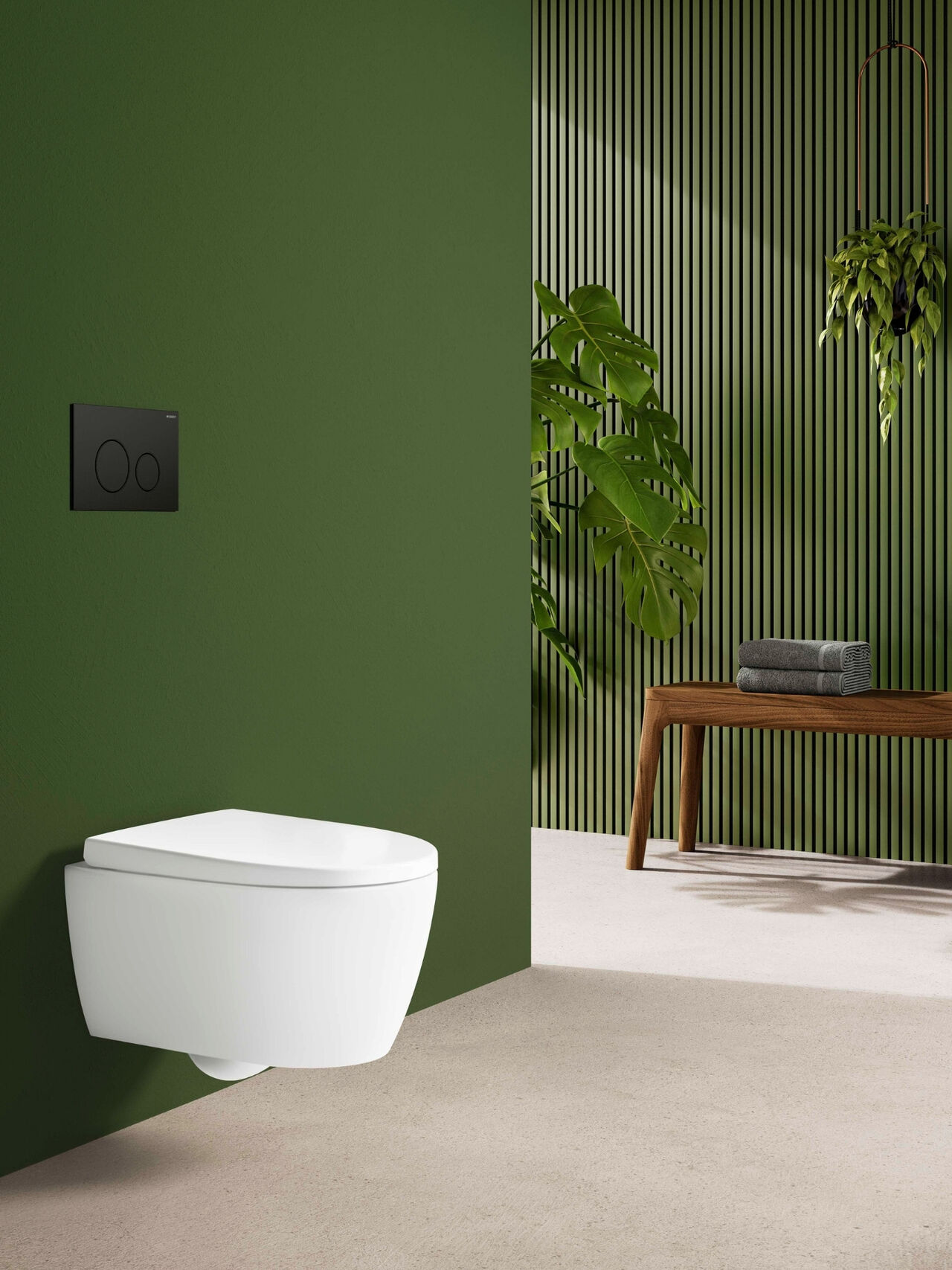 Geberit iCon WC vor grüner Wand: klare Frische mit natürlicher Ausstrahlung
