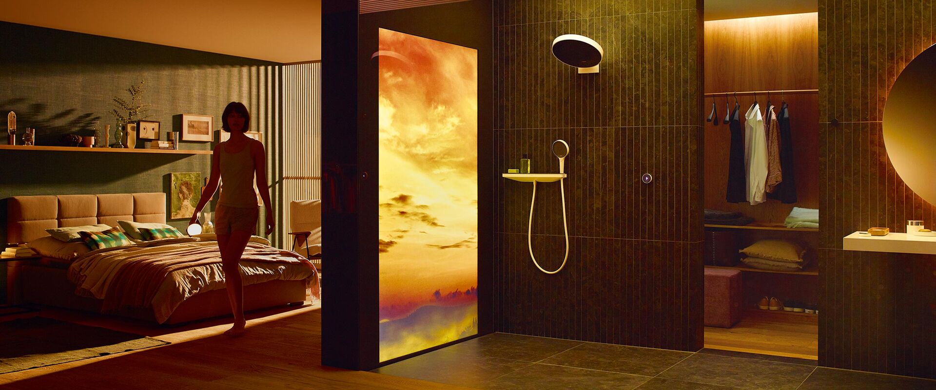 Mit RainTunes von hansgrohe startet der Tag in goldenem Licht und mit warmen Farben: Duschszenario Good Morning, das mit Licht, Duft und Musik arbeitet und so das Wassererlebnis mit Kopf-, Schwall- und Handbrausen unterstützt.