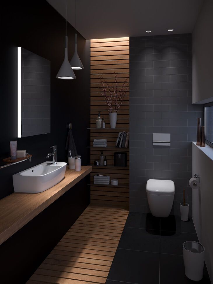 VitrA Bad Shift Gästebad bei Nacht mit Holzstreifen von VitrA Bad mit dem kompakten Aufsatzwaschtisch Shift und einer raumsparenden Toilette mit kurzer Ausladung.