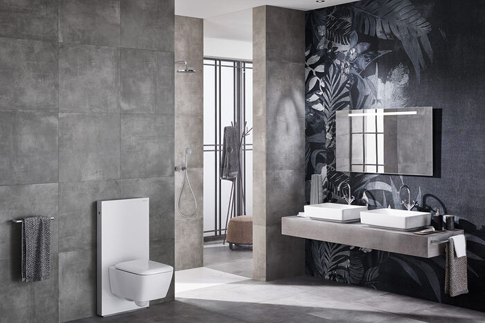 Ganz in grau gehaltenes Badezimmer VariForm von Keramag mit 2 Waschbecken, Spiegel und Toilette.