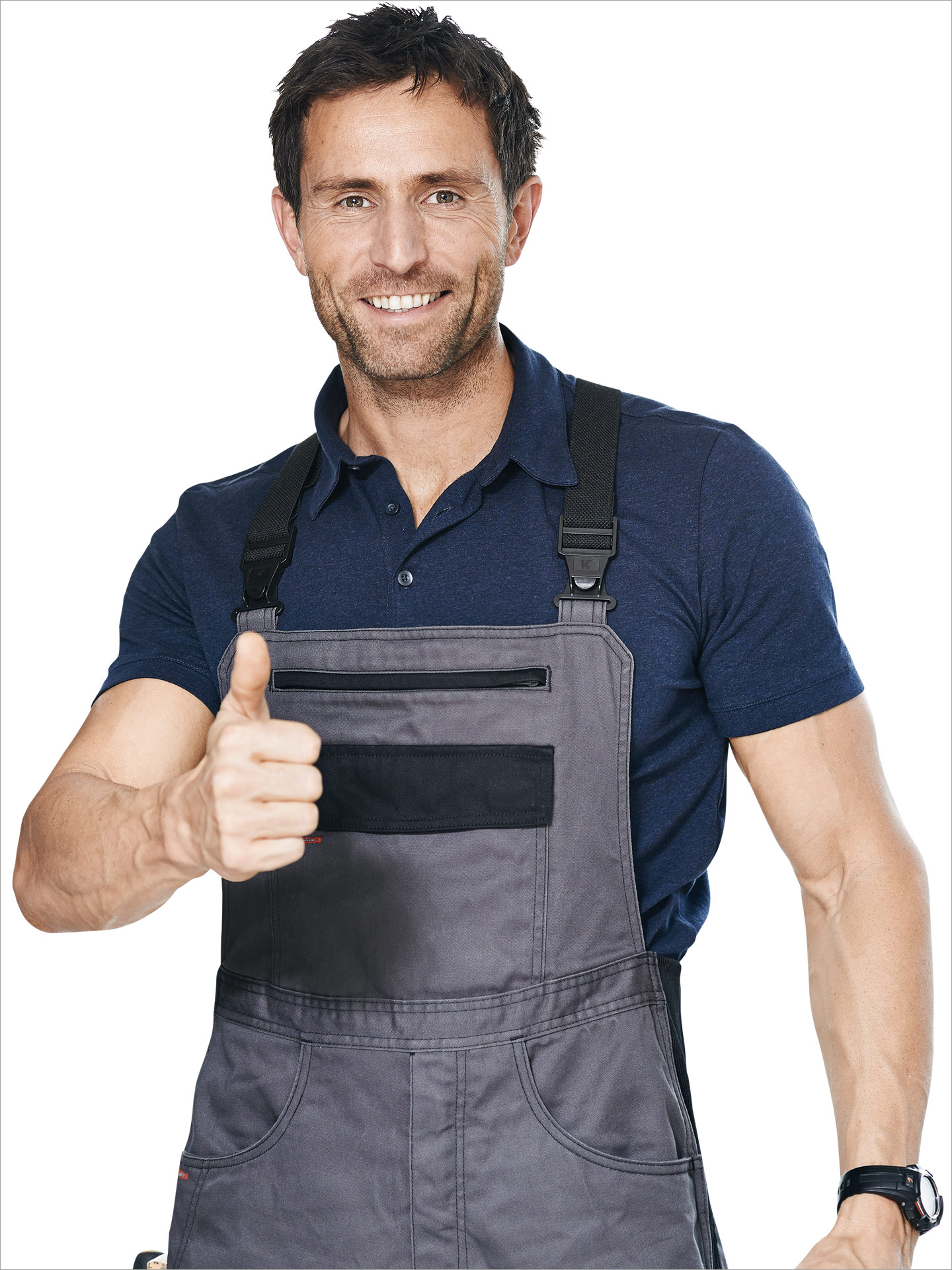 Fachhandverker in Latzhose mit erhobenem Daumen.