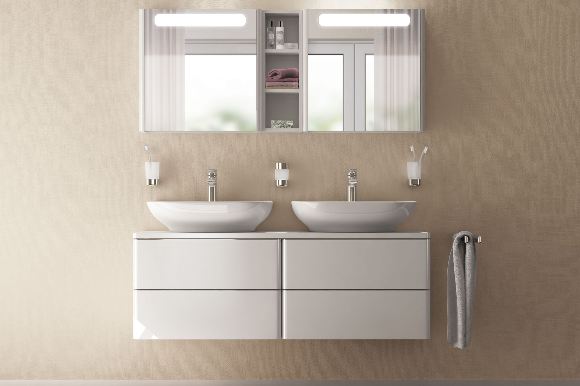 Zwei Aufsatzwaschbecken mit gruaen Badmöbeln und beleuchteten Spiegeln. Bad-Accessoires in Chrom. Softmood Ideal Standard